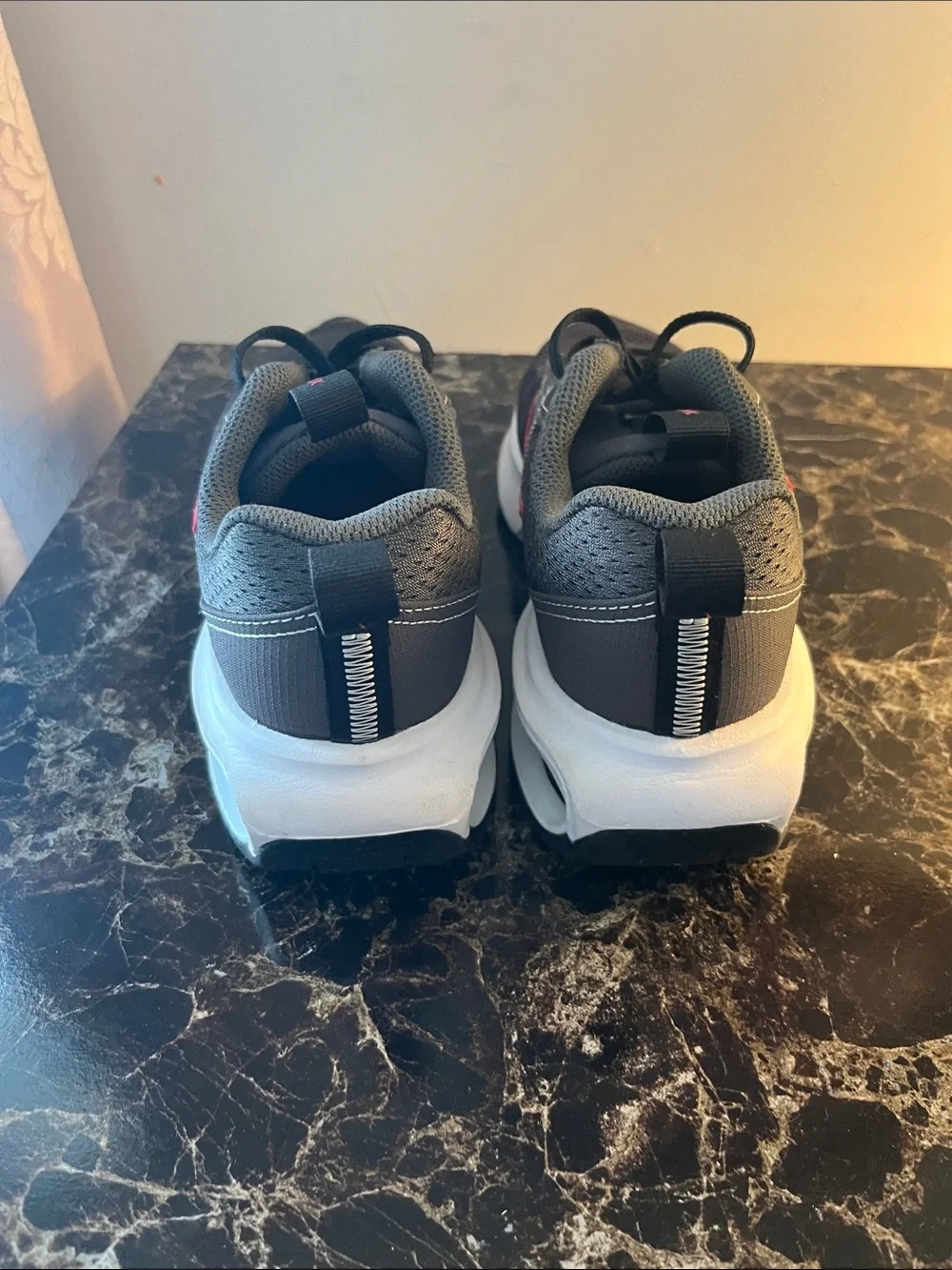 Nike Kids Black Sneakers with Red Swoosh and White Air Sole